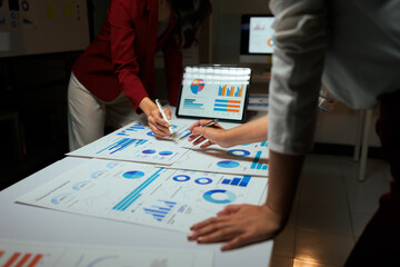 Business people analyzing financial data and charts