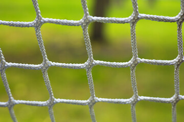 Close up net with green background