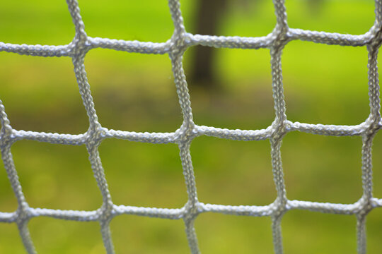 Close up net with green background
