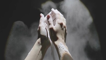 Athlete female hands with chalk powder preparing for workout. Woman using magnesium for grip on hands to train or climb.