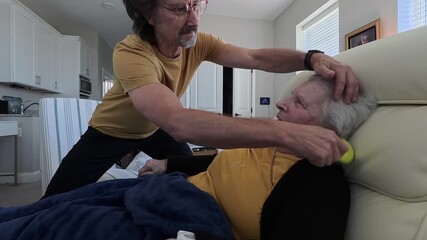 An elderly woman enjoys a heartfelt moment with her son during his visit at the nursing home, highlighting their close bond and care.