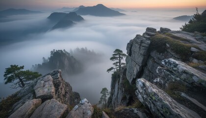Dramatic mountain cliff above sea of fog at sunrise in european alps symbolising challenge hope and exploration