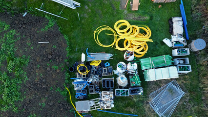 Materials for houses on a new-build housing estate, surrounded by construction equipment