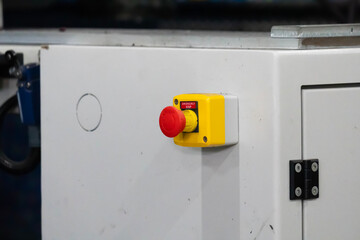 Close up view of an emergency stop push button.