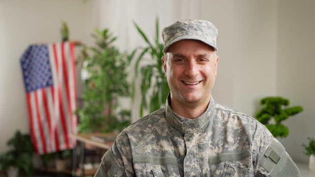American soldier in military uniform smiling at camera