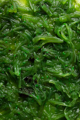 Food background fermented kelp seaweed salad top view