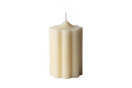 Cream colored fluted pillar candle with white wick isolated on a transparent background