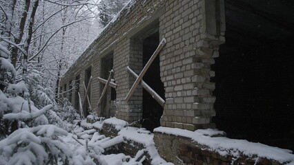 War Ukraine long brick corridor with snow outside, series of window openings framed by wooden braces, deep interior shadows and perspective lines, cold damp atmosphere, composition fit