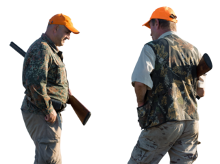 Hunter man in camouflage with a gun during the hunt in search of wild birds or game. Autumn hunting season.