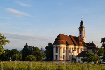 View of the baroque pilgrimage church Birnau with vineyard in the foreground with motion blur effect. Nussdorf, Lake Constance, Germany.