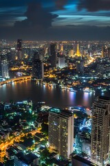 Naklejka premium Bangkok cityscape at night with river and illuminated buildings