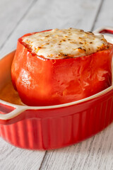 Single red bell pepper baked with bolognese filling and melted mozzarella topping