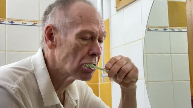 old male retired middle-aged senior mature elderly man cropped view mouth brushing teeth toothbrush and toothpaste morning hygiene procedure oral anti cavity tooth care dental. High quality 4k