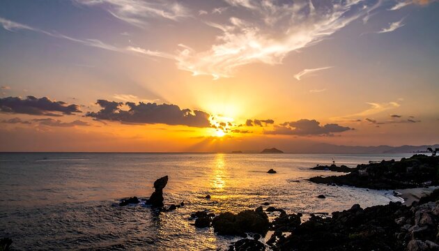 Stunning sunset over the ocean with clouds and rocks casting silhouettes, creating a serene coastal landscape view - Powered by Adobe