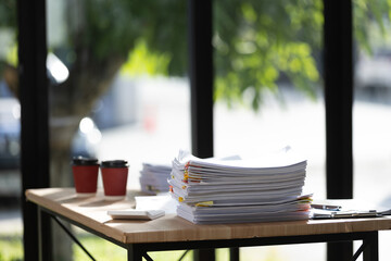 Collaborative executives analyze contracts and financial data, driving strategic decisions, boosting productivity, securing partnerships, and achieving corporate success within a dynamic professional 