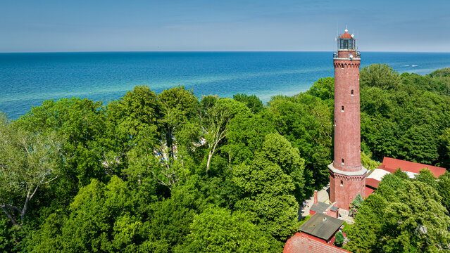 Lighthouse by Baltic sea, Poland. Tourism at Baltic Sea, Poland.