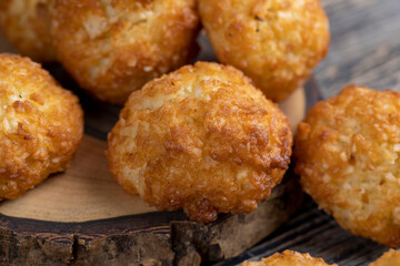 sweet cookies with coconut pieces are on the table, a group of sweet freshly made cookies for a tea party