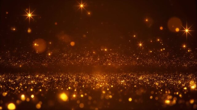 Golden glittering particles flow across a dark background creating a magical and luxurious atmosphere for special events and celebrations
