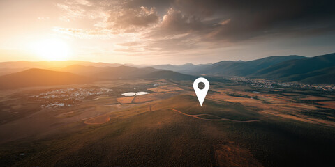 Fototapeta premium Scenic aerial landscape with large white location pin icon at sunset. Travel concept.