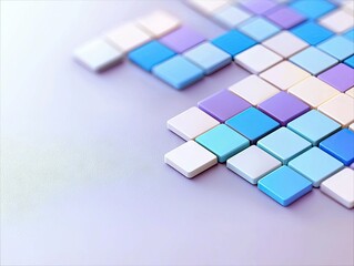A close-up, high-angle view of a grid of small, pastel-colored squares arranged in a diagonal pattern against a soft purple background. The lighting is gentle a