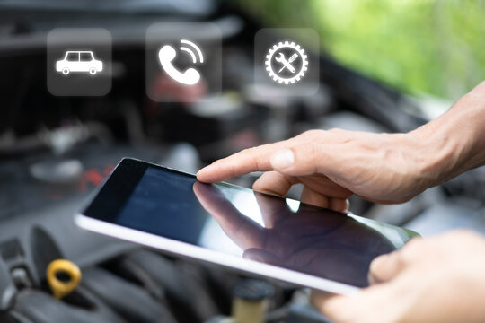 Car Service concept and technology on virtual screen, Serviceman working onsite use tablet check service cycle for maintenance of car