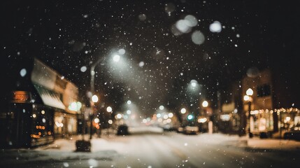 Winter street view with falling white snow, blurred city lights, street lamps, and lined shops and houses. Soft, wintry urban scene capturing snowy night, glowing lights and cozy neighborhood charm.