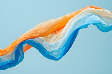 Fototapeta premium Abstract flowing fabric in orange white and blue against a light blue background