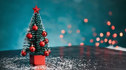 A small decorative christmas tree with red ornaments and a star on a snowy surface. Festive holiday background with magical bokeh lights for a winter celebration greeting card - Powered by Adobe