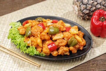 Ayam Asam Manis. Sweet and sour chicken is a Cantonese specialty often found on Chinese restaurant menus.