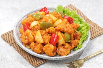 Ayam Asam Manis. Sweet and sour chicken is a Cantonese specialty often found on Chinese restaurant menus.