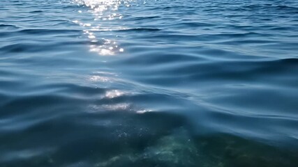 Small boat floats serenely in deep blue sea basking warm sunlight perfectly capturing tranquil atmosphere evoking feelings relaxation calmness conveying sense freedom escape daily life making it.