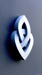 A minimalist, white, interlocking heart-shaped sculpture is mounted on a dark, textured wall, casting a strong shadow. The lighting is dramatic, highlighting th