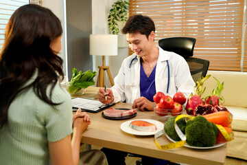 The healthcare professional providing nutritional guidance to a patient, developing healthy diet, dietary program. Dietary consultant asking, giving female patient advice, help