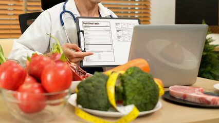 Young nutritionist male giving consultation to patient and making diet plan through meeting on video call Healthy lifestyle nutrition and diet concept