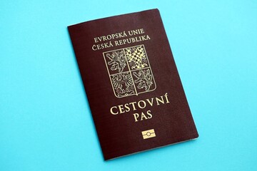 Czech biometrical passport on blue table background. Concept of citizenship of Czech Republic
