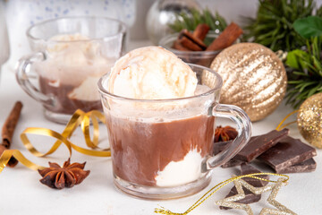 Affogato hot chocolate, on Christmas decorated background. Tasty hot chocolate or cocoa drink with vanilla ice cream scoops, copy space
