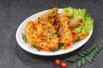 Udang Telur Asin. Salted Egg Prawns is a simple dish made from prawns, salted eggs and curry leaves.