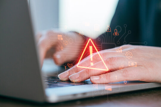 Warning alert on computer screen during online activity in a modern workspace