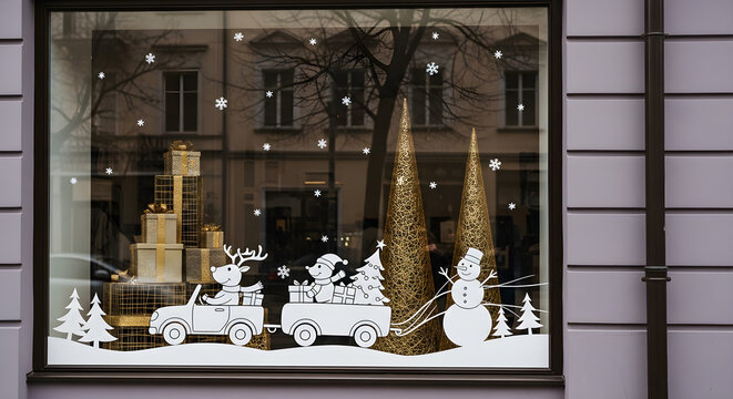 Christmas shop window display with white holiday decals and golden gift boxes - Powered by Adobe