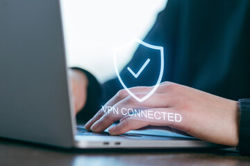Working on a laptop with a VPN connected symbol during a remote session at home office