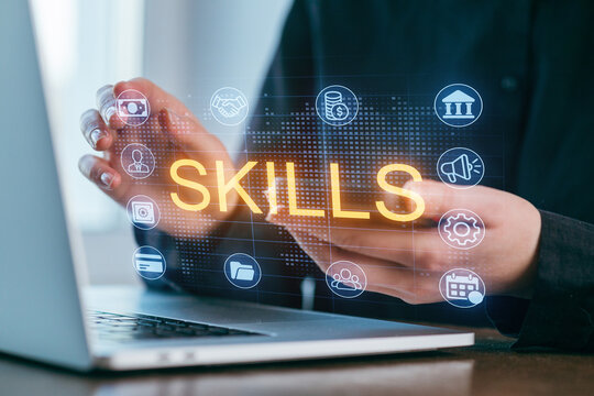 Hands interacting with digital skills icons on a laptop screen in a modern workspace for personal and professional development - Powered by Adobe