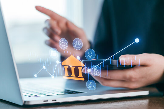 Digital banking concepts with laptop and smartphone showing financial data and security icons in a modern workspace