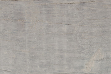 Gray concrete texture with fine sand particles background