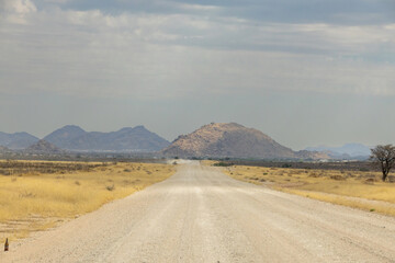 empty gravel road in wild of hardap region in namibia