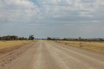 empty gravel road in wild of hardap region in namibia