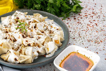 Traditional Turkish dish manti. Traditional dish made with handmade dough and minced meat.	