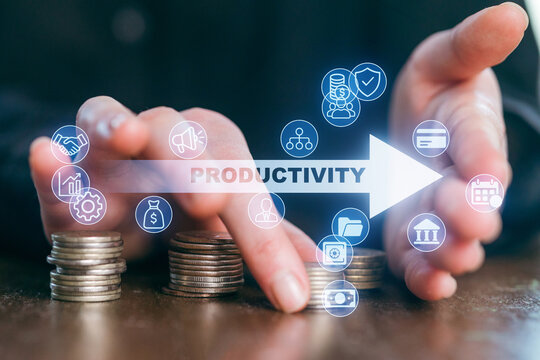 Hands pushing coins with icons representing growth and productivity in a business setting