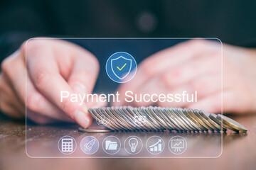 Payment confirmation screen displays successful transaction with hands counting coins on wooden table