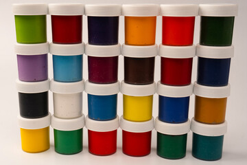 Gouache colorful paints set. Jars of gouache paint isolated on a white background.
