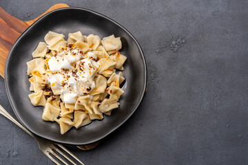 Traditional Turkish dish manti. Traditional dish made with handmade dough and minced meat.